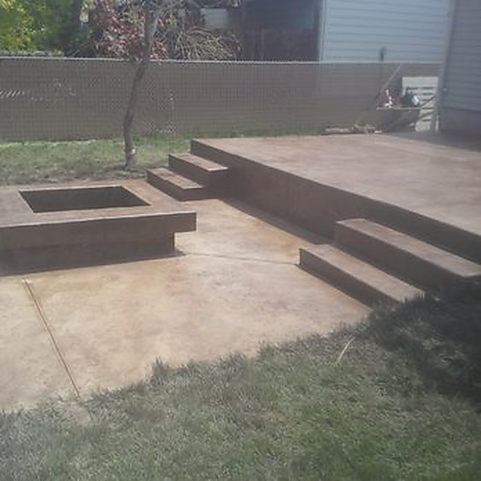 Finished stamped concrete patio with fire pit cutout