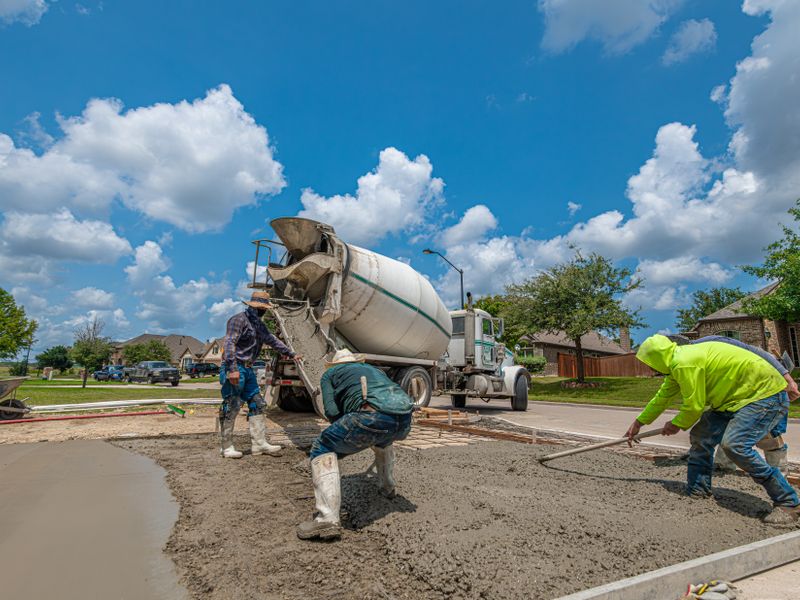 Concrete driveway installation in progress by Creative Edge Concrete